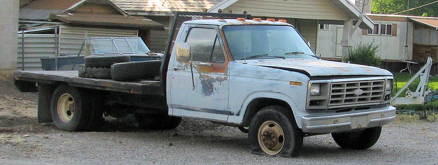 classic ford truck vintage rust rusty pickup dent rusted flattire 1986 retired dents beater madeinusa americanmade flatbed f350 dented worktruck oneton primergray eyellgeteven