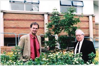 Professor Jeff Almond and Dr John Grainger planting a tree in memory of Professor Knight