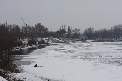 Fisher on frozen river ©  Eugene Romanenko