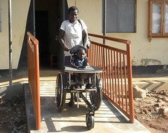 A happy Aida and Mom use their new wheelchair ...