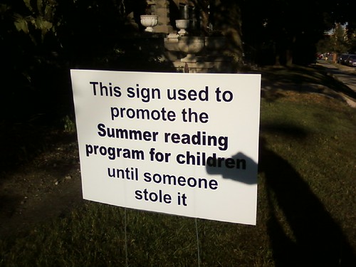 This sign used to promote the Summer reading program for children until someone stole it