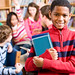 African American boy in school library smiling