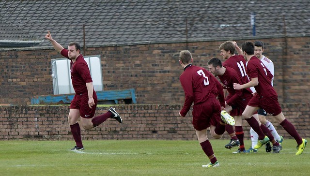 Chris Walker is pursued by his team-mates after heading Shotts two ahead