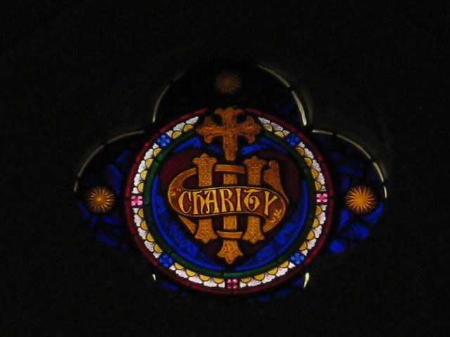 The Charity Lunette of the Stained Glass Chancel Window; St Judes Church of England - Corner of Lygon, Palmerston and Keppel Streets, Carlton