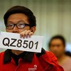 DESPERATE RELATIVES ANXIOUSLY AWAIT INFO OF  MISSING MALAYSIAN AIRLINES AIRASIA FLIGHT #QZ8501 TRAVELLING FROM SINGAPORE TO IINDONESIA AROUND 10 HOURS AGO TODAY