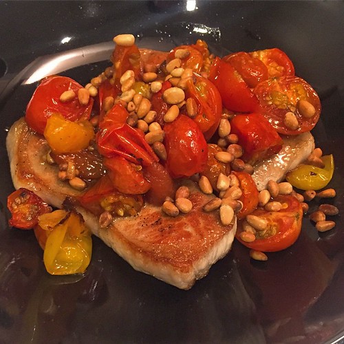 home-cooked sous vide pork chop, roasted cherry tomatoes and pine nuts.