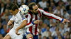 El delantero mexicano del Real Madrid Javier Hernández “Chicharito” salta por el balón con Juanfran, del Atlético de Madrid