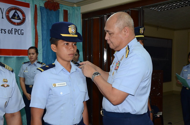 PCG Commandant Vice Admiral Rodolfo D Isorena led the donning and oath taking ceremony of the newly appointed and promoted officers of the Philippine Coast Guard.  The officers composed of the five newly commissioned probationary ensigns who were graduate