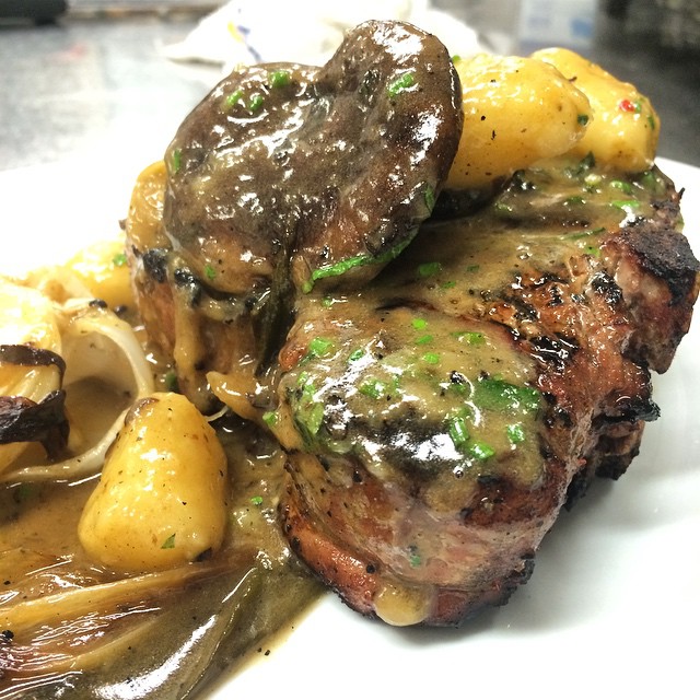 Wood grilled pork chop with gnocchi, shiitake, spring onion & black truffle butter