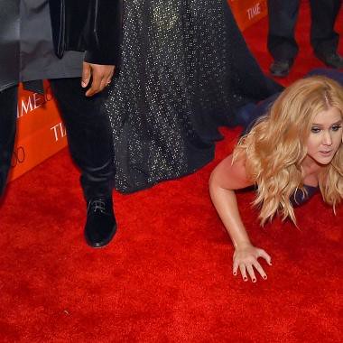 From Time: AMY SCHUMER takes a dive on the red carpet before Kanye and Kim Kardashian