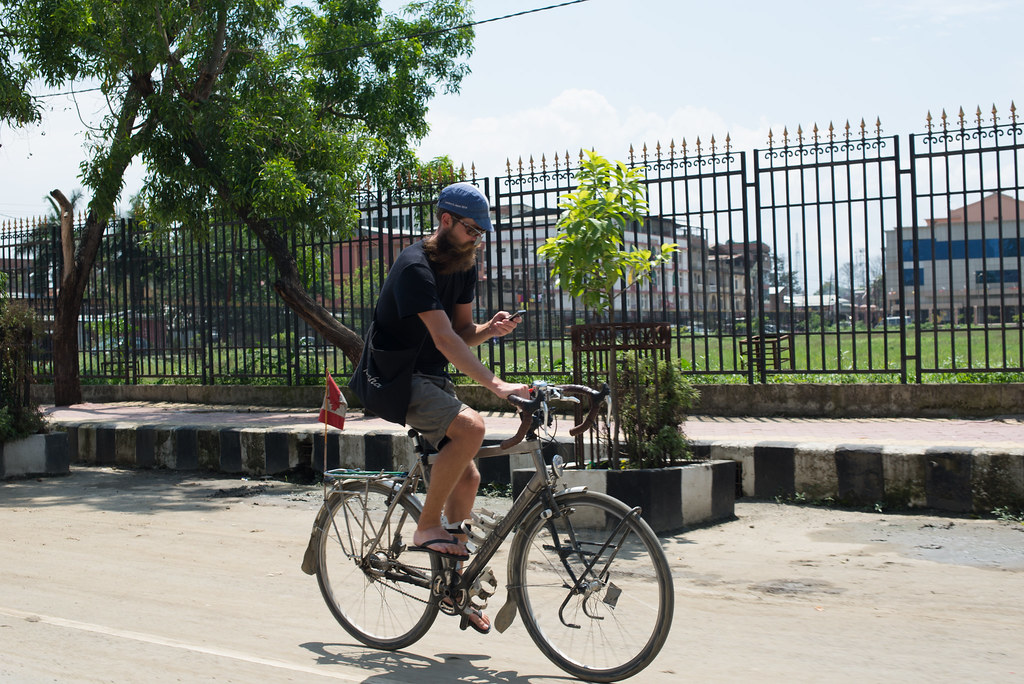 Hipster Dre cycling the streets of Imphal
