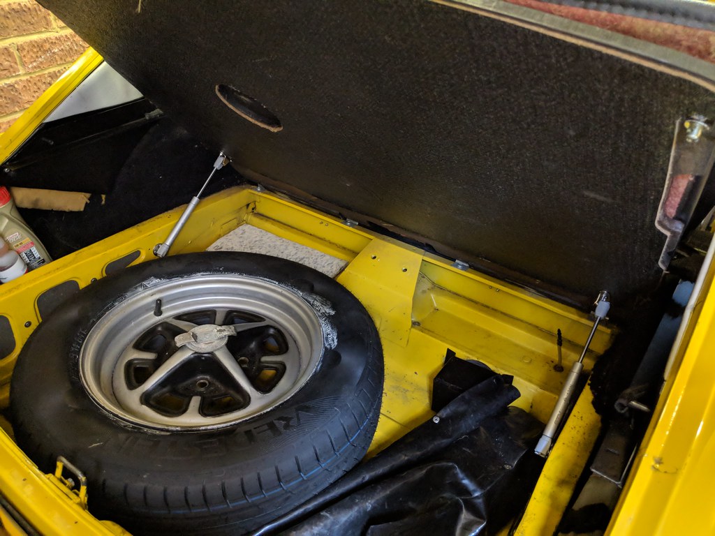 The interior of the boot with the floor raised showing the two struts