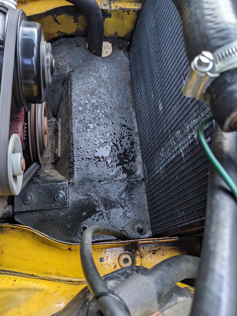 Water splashes in the engine bay between the radiator and engine