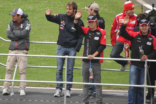 The drivers on the Formula One Drivers' Parade at the 2012 British Grand Prix at Silverstone