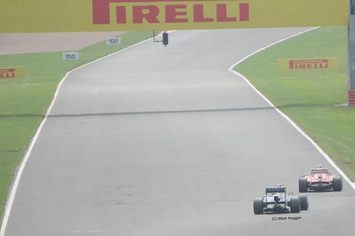 Mark Webber chases Fernando Alonso down the Hangar Straight at Silverstone in the 2012 British Grand Prix