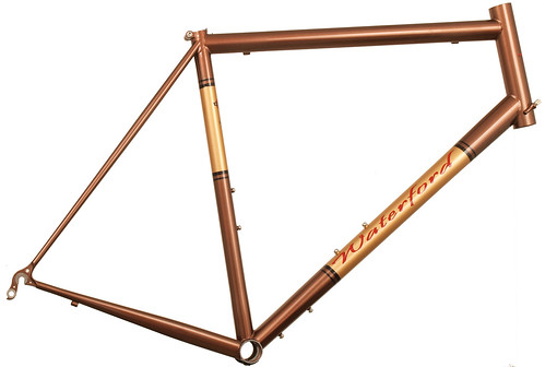 <p>This is a 33-Series frame using our Road Sport handling and head tube cable guides.  The rider hydrates heavily during rides; hence the unusual combination of a 3rd set of water bottle bosses with no eyelets or rack mounts.  Styled Copper Met with Goldfinge Panels.</p>