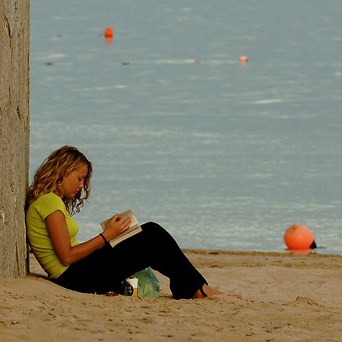 Girl reading at the beach by pedrosimoes7, on Flickr
