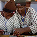 Women work together on solar lighting circuit boards