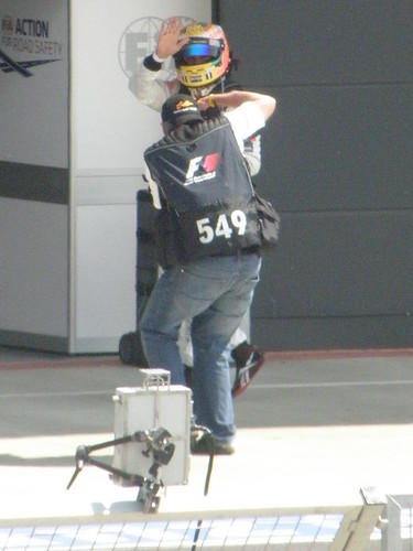 A photographer takes a pic of Lewis Hamilton after the 2011 British Grand Prix at Silverstone