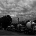 cement trucks in Oil City, Louisiana underneath a brewing storm.