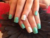 Acrylic nails with mint green and white gel polish