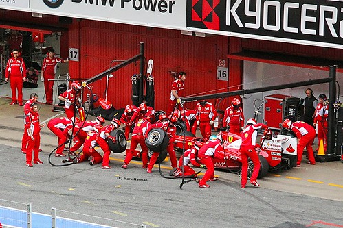 The Ferrari team practice a pit stop for Fernando Alonso at Formula One Winter Testing, Circuit de Catalunya, March 2012