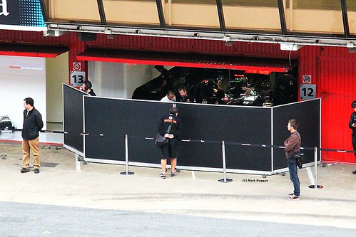 Lewis Hamilton in the McLaren garage with his engineers at Formula One Winter Testing, Circuit de Catalunya, March 2012