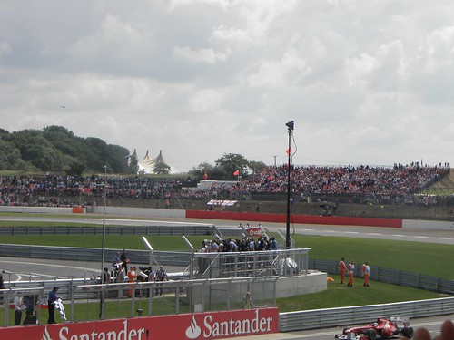 Fernando Alonso returns to the pits after winning the 2011 British Grand Prix at Silverstone