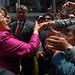 UN Women Executive Director Michelle Bachelet greets crowds at her arrival at the textile production and trade center of Gamarra in Lima, Peru, on 16 October 2012