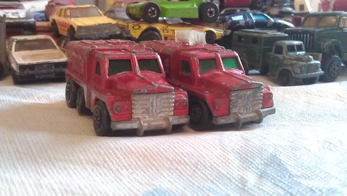 Vintage red toy armored trucks 