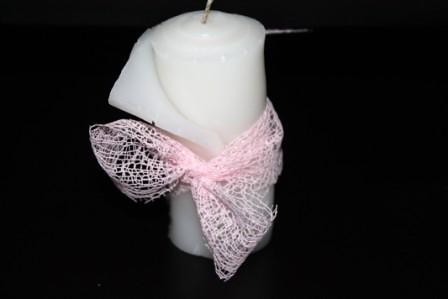 ROLLED WHITE CANDLE ADORNED WITH A PINK RIBBON