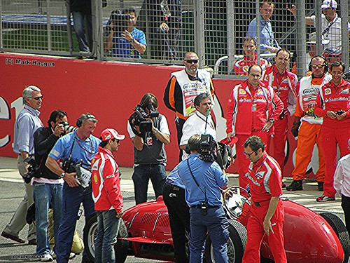 Felipe Massa watches Fernando Alonso race a historic Ferrari at the 2011 British Grand Prix