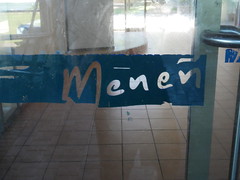 Menen Hotel, once a luxury hotel but now only a structure with mold, closed doors, refugees, and terrible information.