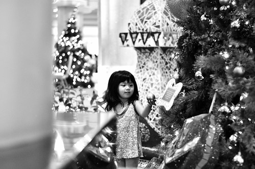 Little Girl at Christmas Tree