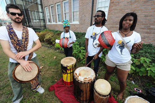 The KoumenKele African Dance & Drum Ensemble prepare for their performance with the Wharton School Drummers.