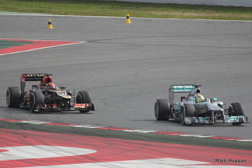 Kimi Raikkonen in his Lotus and Nico Rosberg in his Mercedes at Formula One Winter Testing, March 2013