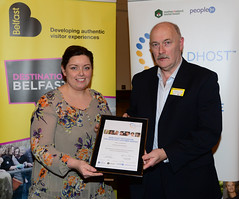 Worldhost participant Theodore McLaughlin (on behalf of All Seasons Bed and Breakfast) pictured with Councillor Deirdre Hargey