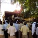 the boys of the Niani Upper and Senior Secondary School unloading the truck