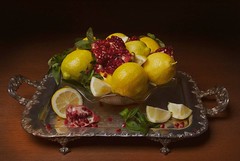 A Still Life of a Wanli Kraak Porcelain Bowl of Citrus Fruit and Pomegranates on a Wooden Table