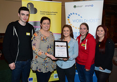Worldhost participants from Rockies Sports Bar pictured with Councillor Deirdre Hargey