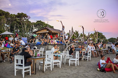A beach bar is a great place to watch the sunest.