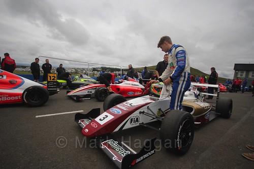 Sennan Fielding getting into his car ahead of the British Formula Four race 2 during the BTCC Knockhill Weekend 2016