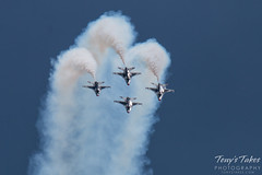 The Thunderbirds four ship coming over the top of a loop