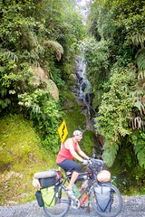 Philip cycles past a waterfall.